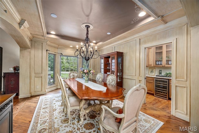 701 Crown Pointe Farms, Defiance, MO 63341 - dining area with wine cooler, ornamental molding, a chandelier, light wood-style flooring, and recessed lighting