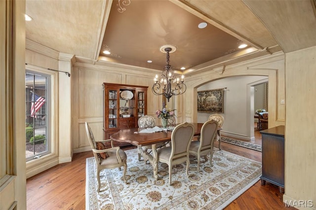 701 Crown Pointe Farms, Defiance, MO 63341 - dining room featuring a chandelier, wood finished floors, ornamental molding, arched walkways, and recessed lighting
