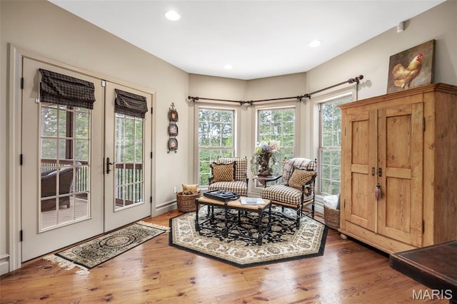 701 Crown Pointe Farms, Defiance, MO 63341 - living area with french doors, wood finished floors, healthy amount of natural light, and recessed lighting