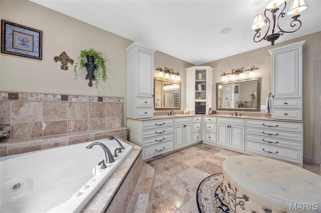 701 Crown Pointe Farms, Defiance, MO 63341 - full bath featuring double vanity, a tub with jets, and a chandelier