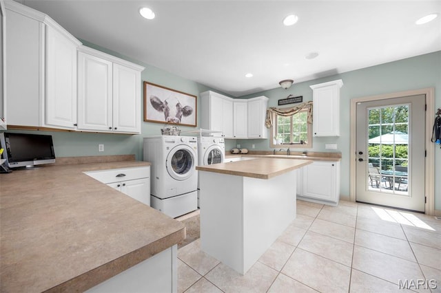 701 Crown Pointe Farms, Defiance, MO 63341 - laundry room featuring washing machine and clothes dryer, cabinet space, light tile patterned floors, and recessed lighting