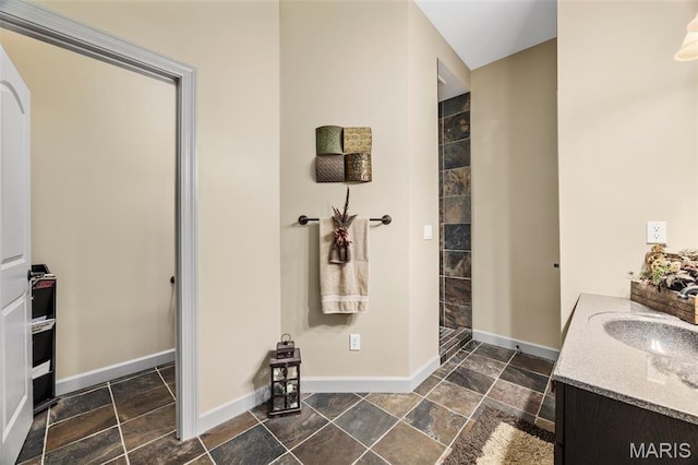 701 Crown Pointe Farms, Defiance, MO 63341 - bathroom featuring a tile shower, vanity, and stone tile floors