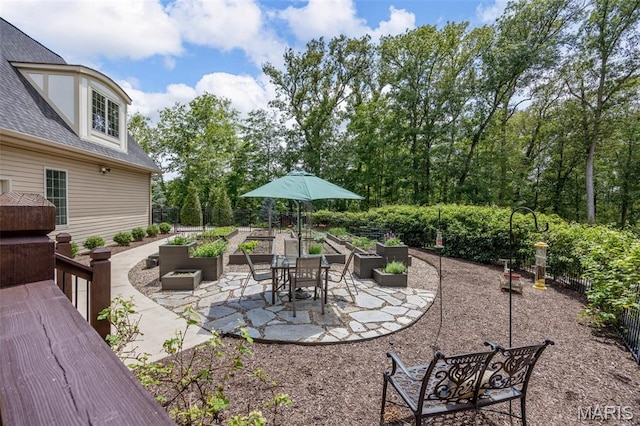 701 Crown Pointe Farms, Defiance, MO 63341 - view of patio / terrace featuring a garden