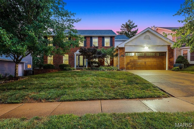 3038 Woodbridge Creek Dr, Saint Louis, MO 63129 - view of front of house featuring brick siding, a garage, a lawn, and concrete driveway
