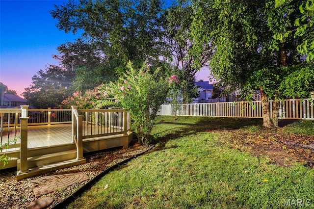 3038 Woodbridge Creek Dr, Saint Louis, MO 63129 - yard at dusk featuring a deck