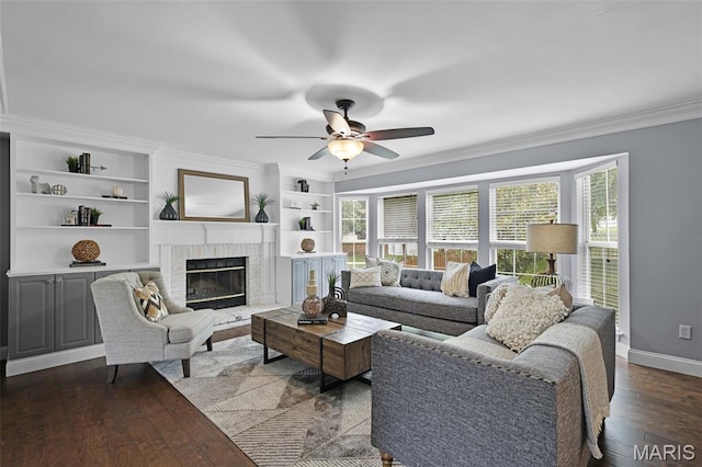 3038 Woodbridge Creek Dr, Saint Louis, MO 63129 - living room with ornamental molding, ceiling fan, a fireplace, dark wood-type flooring, and built in features