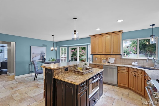 3038 Woodbridge Creek Dr, Saint Louis, MO 63129 - kitchen featuring dishwasher, range, backsplash, light stone counters, and decorative light fixtures