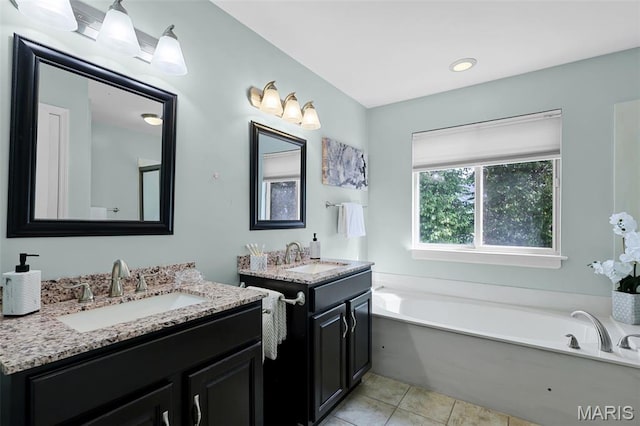 3038 Woodbridge Creek Dr, Saint Louis, MO 63129 - full bath with a bath, two vanities, and tile patterned floors