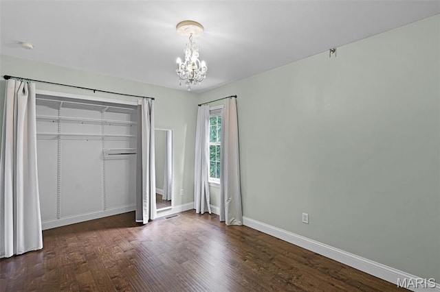 3038 Woodbridge Creek Dr, Saint Louis, MO 63129 - unfurnished bedroom featuring a chandelier, wood finished floors, and a closet