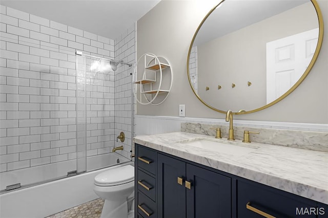 3038 Woodbridge Creek Dr, Saint Louis, MO 63129 - bathroom with vanity, bath / shower combo with glass door, and wainscoting