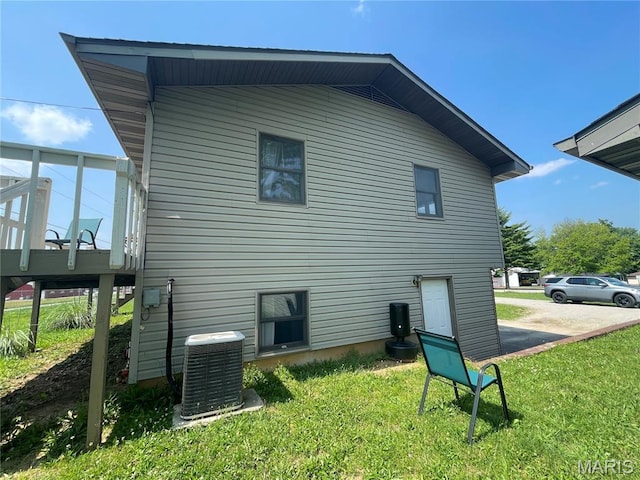 128 Myers St, Licking, MO 65542 - rear view of property featuring a lawn and a wooden deck