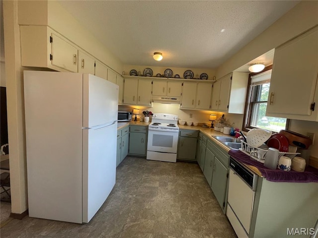 128 Myers St, Licking, MO 65542 - kitchen featuring white appliances, under cabinet range hood, a textured ceiling, and light countertops