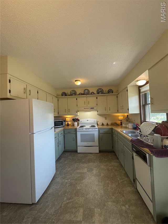 128 Myers St, Licking, MO 65542 - kitchen featuring white appliances, under cabinet range hood, a textured ceiling, and white cabinets