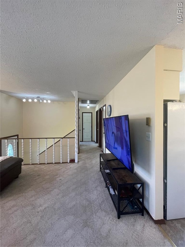 128 Myers St, Licking, MO 65542 - carpeted living area featuring a textured ceiling
