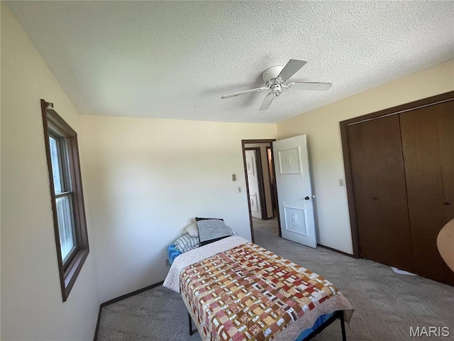 128 Myers St, Licking, MO 65542 - bedroom featuring light colored carpet, a closet, ceiling fan, and a textured ceiling