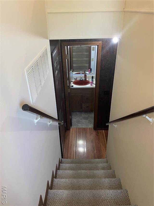 128 Myers St, Licking, MO 65542 - staircase featuring wood finished floors