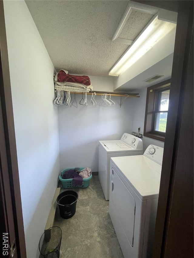 128 Myers St, Licking, MO 65542 - laundry area featuring separate washer and dryer and a textured ceiling