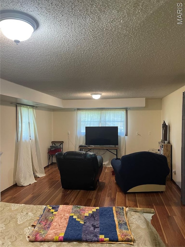 128 Myers St, Licking, MO 65542 - living area with a textured ceiling and wood finished floors