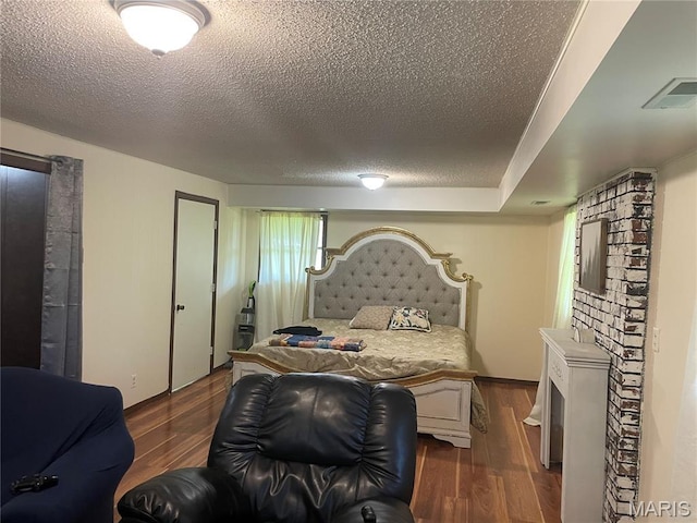 128 Myers St, Licking, MO 65542 - bedroom with wood finished floors and a textured ceiling