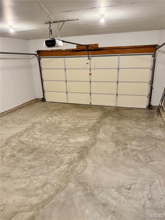 51 Tower St, Moscow Mills, MO 63362 - garage with a garage door opener
