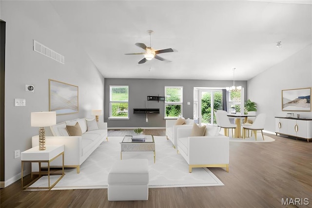 1161 Foxwood Estates Dr, Arnold, MO 63010 - living area with wood finished floors, lofted ceiling, ceiling fan, and a chandelier