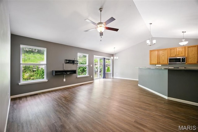 1161 Foxwood Estates Dr, Arnold, MO 63010 - unfurnished living room with a chandelier, vaulted ceiling, dark wood-type flooring, and plenty of natural light