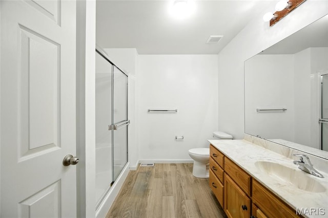1161 Foxwood Estates Dr, Arnold, MO 63010 - full bathroom with vanity, a shower stall, and wood finished floors