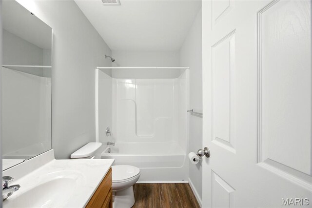 1161 Foxwood Estates Dr, Arnold, MO 63010 - bathroom featuring vanity, wood finished floors, and shower / bathtub combination