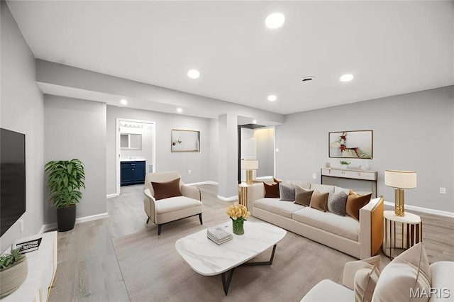 1161 Foxwood Estates Dr, Arnold, MO 63010 - living room featuring light wood-style floors and recessed lighting
