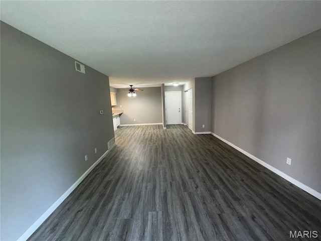 1420 Heritage Lndg Unit 107, Saint Charles, MO 63303 - unfurnished living room with a ceiling fan and dark wood finished floors