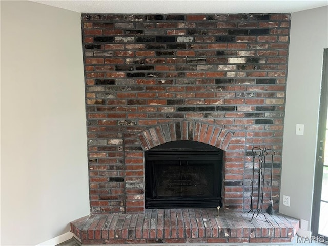 1420 Heritage Lndg Unit 107, Saint Charles, MO 63303 - detailed view of a fireplace and baseboards