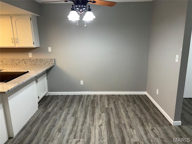 1420 Heritage Lndg Unit 107, Saint Charles, MO 63303 - unfurnished dining area with a ceiling fan and dark wood-style floors
