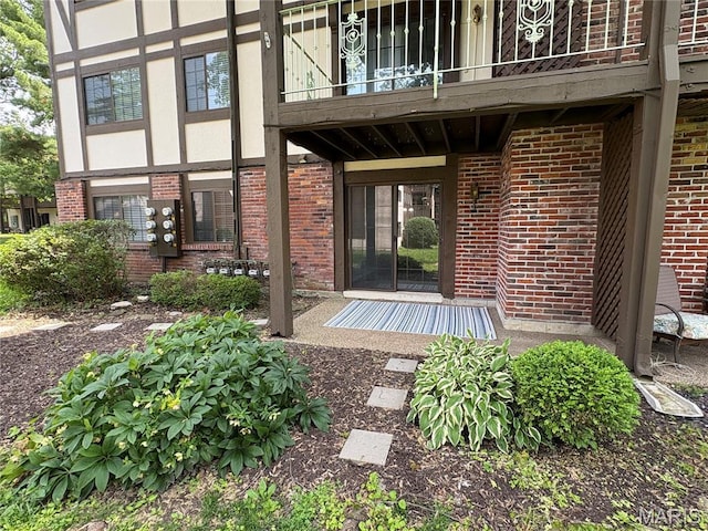 1420 Heritage Lndg Unit 107, Saint Charles, MO 63303 - property entrance with brick siding and a balcony