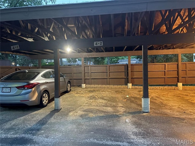 1420 Heritage Lndg Unit 107, Saint Charles, MO 63303 - garage featuring covered parking