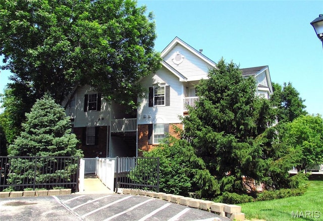 450 Benton Dr Unit J, Saint Peters, MO 63376 - view of front of house featuring uncovered parking and brick siding