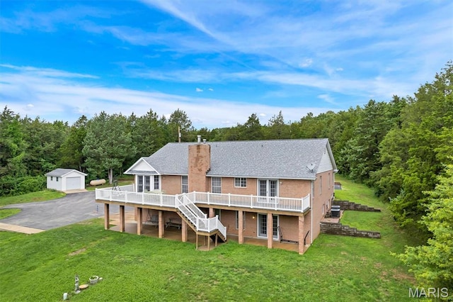2518 Nike Base Rd, Catawissa, MO 63015 - back of property featuring a deck, an outbuilding, a chimney, stairs, and a yard
