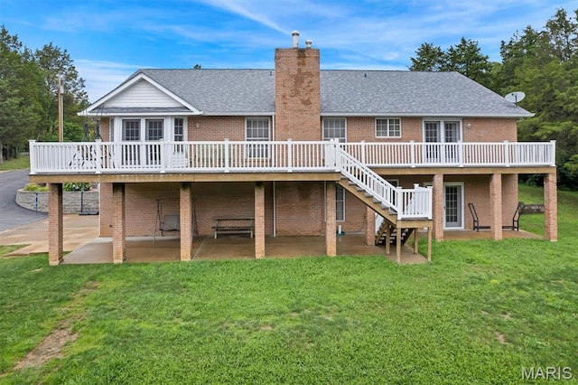 2518 Nike Base Rd, Catawissa, MO 63015 - rear view of house featuring a patio, a wooden deck, brick siding, and a yard