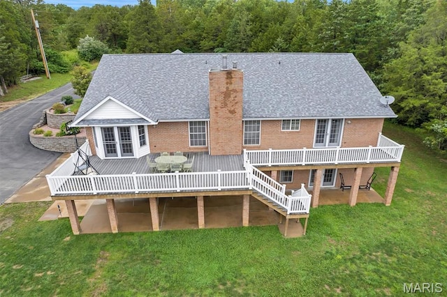 2518 Nike Base Rd, Catawissa, MO 63015 - rear view of property with brick siding, a wooden deck, and a chimney