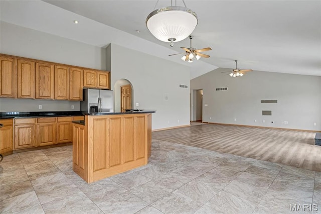 2518 Nike Base Rd, Catawissa, MO 63015 - kitchen featuring stainless steel fridge with ice dispenser, a ceiling fan, dark countertops, a kitchen island, and pendant lighting
