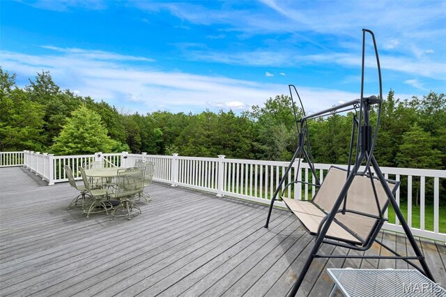 2518 Nike Base Rd, Catawissa, MO 63015 - deck featuring outdoor dining area and a wooded view