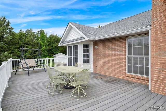 2518 Nike Base Rd, Catawissa, MO 63015 - deck featuring outdoor dining area and a storage unit