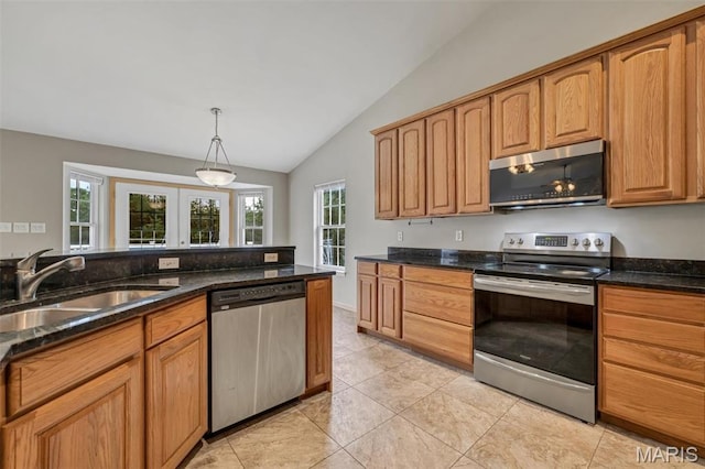 2518 Nike Base Rd, Catawissa, MO 63015 - kitchen featuring appliances with stainless steel finishes, vaulted ceiling, dark stone countertops, light tile patterned floors, and pendant lighting
