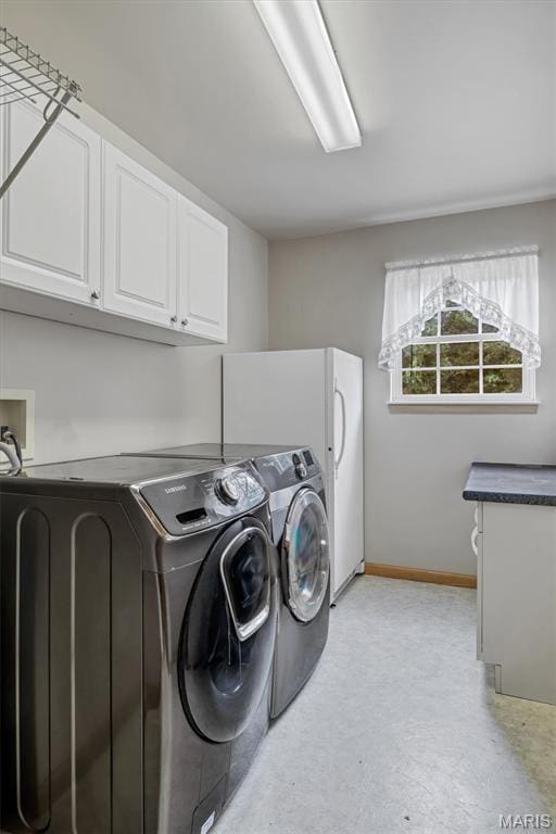 2518 Nike Base Rd, Catawissa, MO 63015 - laundry area featuring cabinet space and washer and dryer