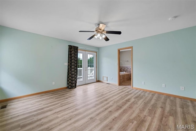2518 Nike Base Rd, Catawissa, MO 63015 - unfurnished room featuring french doors, a smoke detector, light wood finished floors, and ceiling fan