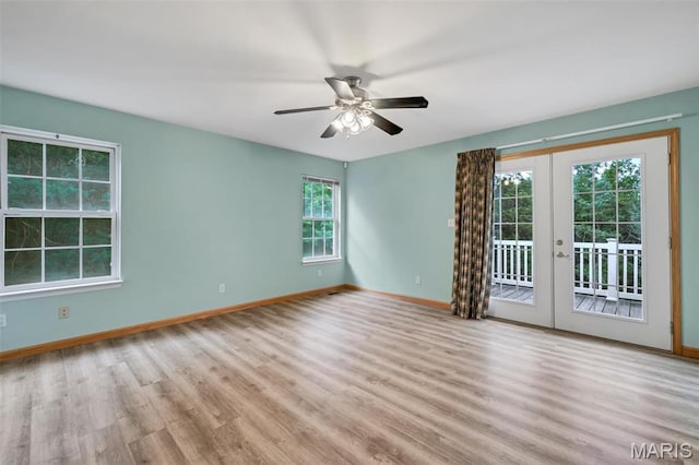 2518 Nike Base Rd, Catawissa, MO 63015 - spare room featuring french doors, wood finished floors, and a ceiling fan