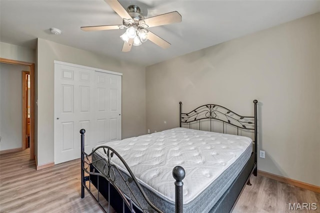 2518 Nike Base Rd, Catawissa, MO 63015 - bedroom featuring a closet, light wood-type flooring, and a ceiling fan