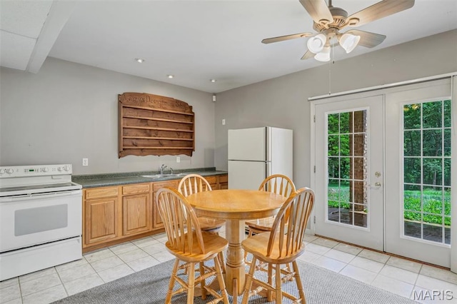 2518 Nike Base Rd, Catawissa, MO 63015 - kitchen featuring white appliances, light tile patterned floors, dark countertops, a ceiling fan, and recessed lighting