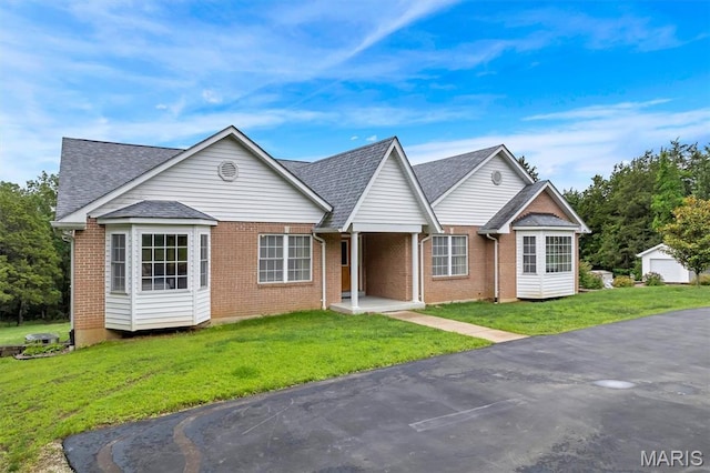 2518 Nike Base Rd, Catawissa, MO 63015 - view of front of property featuring brick siding, a front lawn, and a shingled roof