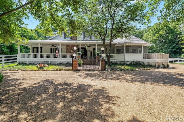 2466 State Road Ff, Eureka, MO 63025 - farmhouse-style home with ceiling fan, a porch, a sunroom, and a gate