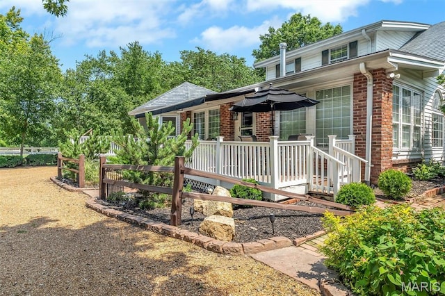 2466 State Road Ff, Eureka, MO 63025 - view of front facade with brick siding and a wooden deck